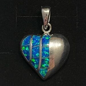 Sterling silver heart pendant with a pop of blue green. Simple. Feminine
